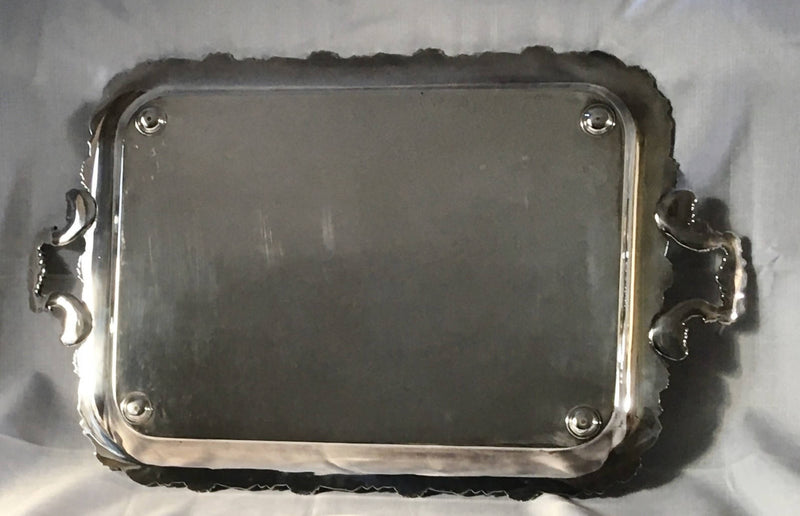 A 19th century ornate Sheffield Plated twin handled serving tray.
