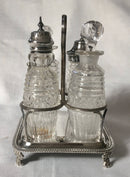 Georgian, George III, silver cruet stand with later silver mounted cut glass bottles. Circa 1784 - 1821. 4.9 troy ounces.