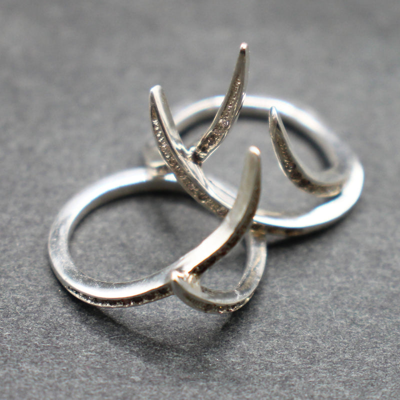 Jake: Pair of interlocking silver “Thorn” rings