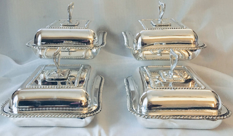 Georgian, George III, set of four Sheffield Plated entree dishes and covers with matching crests. Circa 1810.