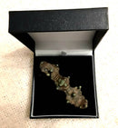 A Viking Large Bronze Equal Ended Cloak Brooch With Green Glass Bead Decoration.