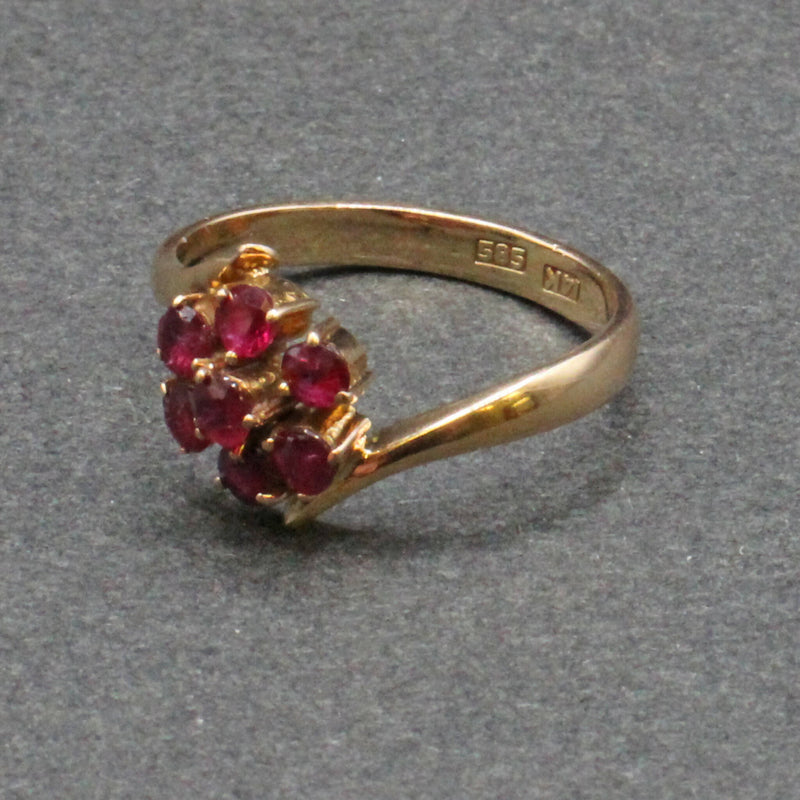 14ct gold ruby 2 tier flower head crossover ring