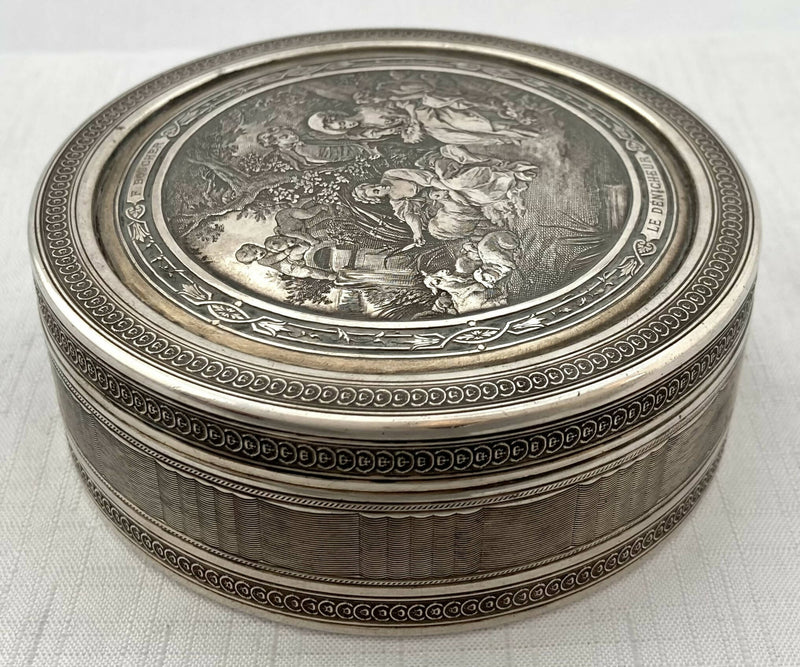 Edwardian Circular Silver Box. Engraved with Le Denicheur, after Boucher. London 1910 Andrew Barrett & Sons. 6.7 troy ounces.