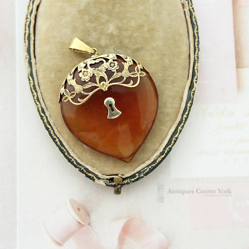 Early Victorian 15ct Gold & Amber Love Pendant