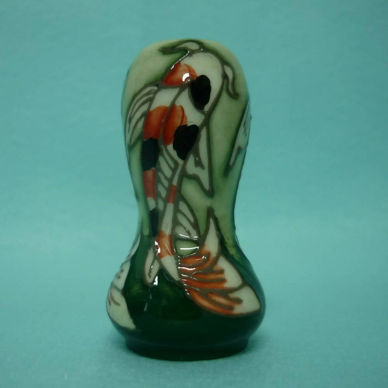 A Miniature Moorcroft Vase with Box and Sleeve.