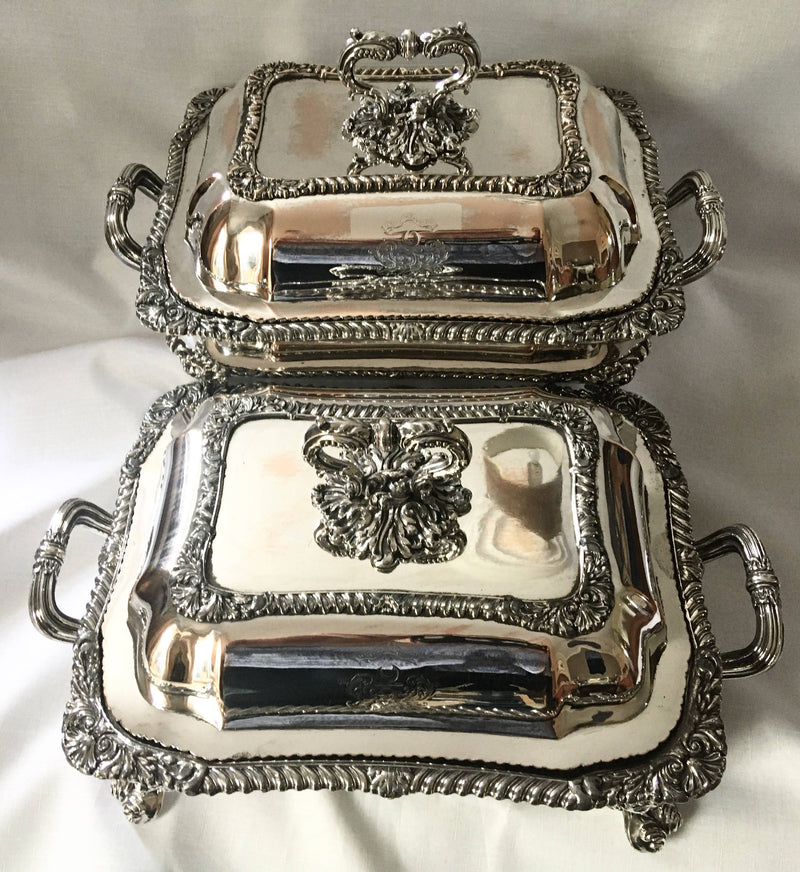 Late Georgian pair of Old Sheffield Plated, crested, entree dishes and covers on warming stands. Circa 1820.