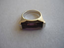 A Silver Ring With an Amethyst Colour Stone