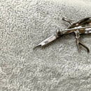 Silver enamel bird brooch