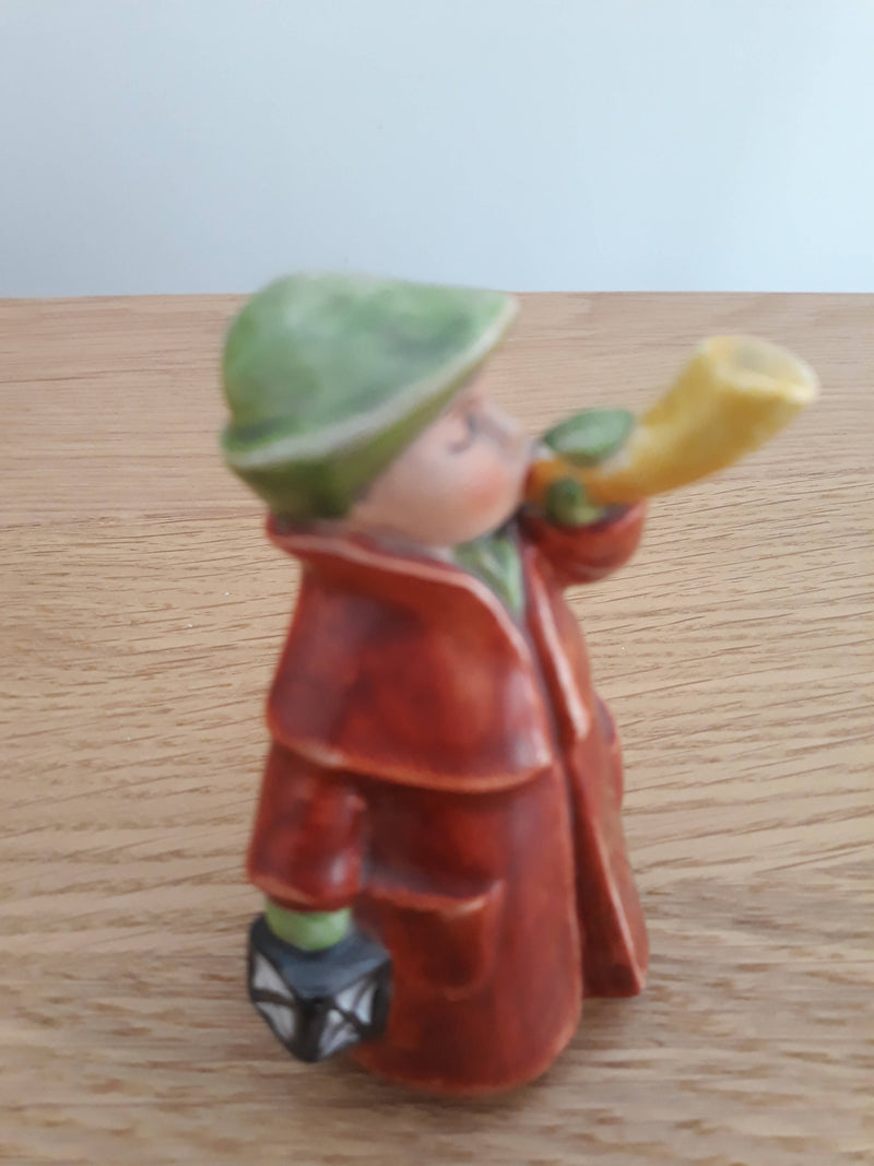 GOEBEL/HUMMEL figure of a boy blowing a horn.