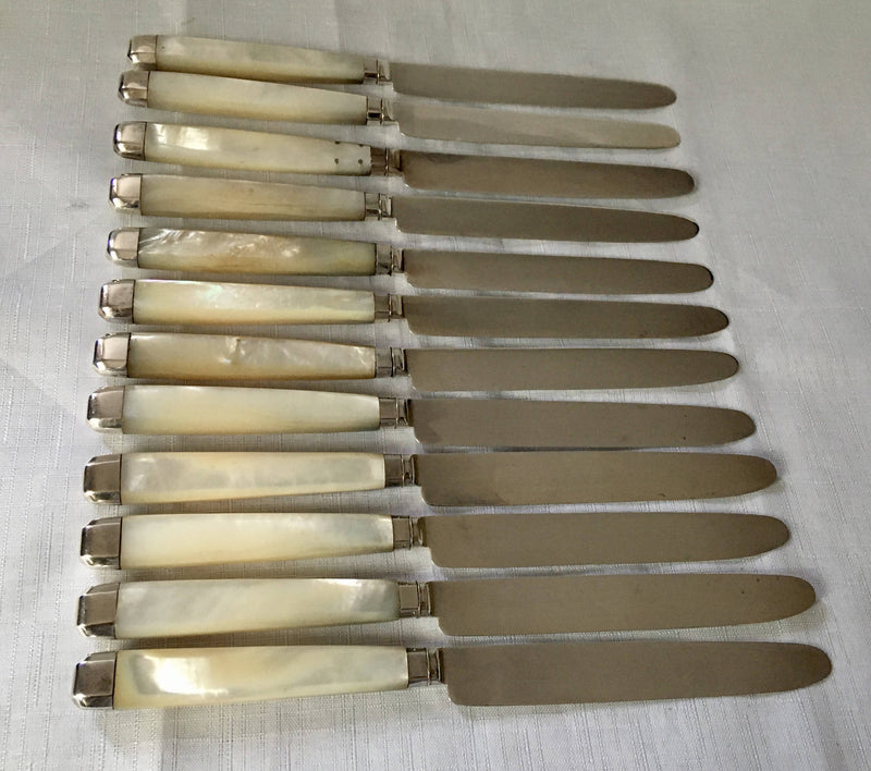 Georgian, George III, silver and mother of pearl dessert knives and forks for twelve, circa 1810.