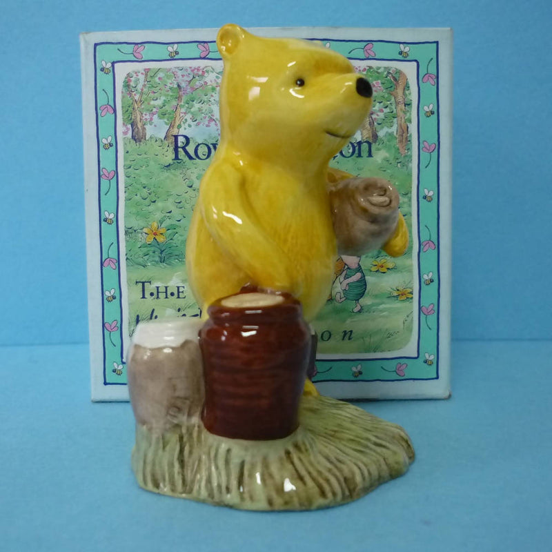 A Boxed Royal Doulton Winnie The Pooh Figurine - Pooh Counting The Honeypots