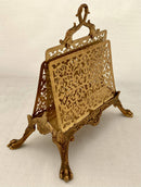 Gilt Metal Correspondence Stand on Lion Paw Feet with Dolphin Handle.