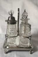 Georgian, George III, silver cruet stand with later silver mounted cut glass bottles. Circa 1784 - 1821. 4.9 troy ounces.