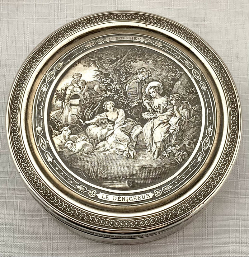 Edwardian Circular Silver Box. Engraved with Le Denicheur, after Boucher. London 1910 Andrew Barrett & Sons. 6.7 troy ounces.