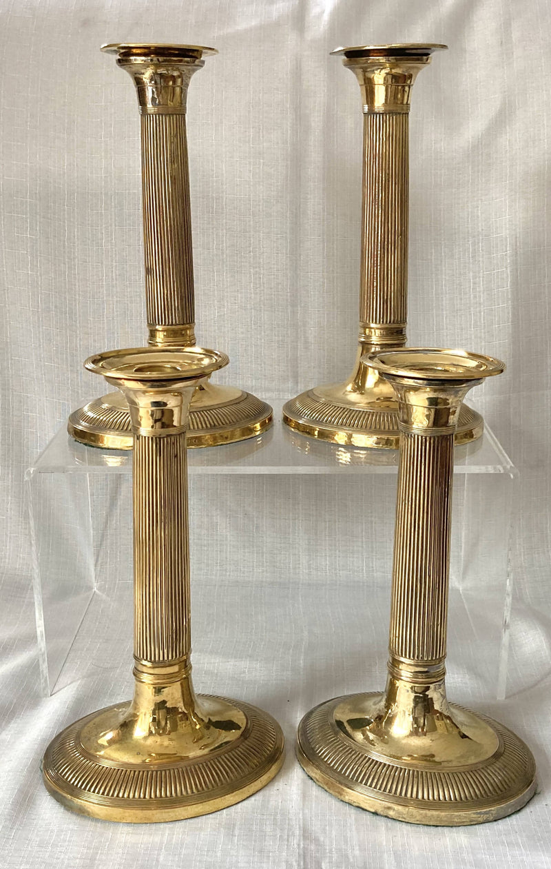Early 19th Century Set of Four Gilded Old Sheffield Plate Candlesticks.
