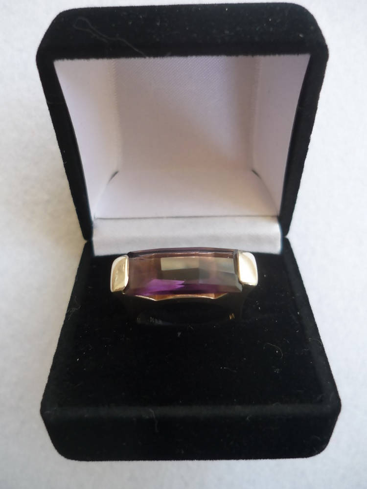 A Silver Ring With an Amethyst Colour Stone