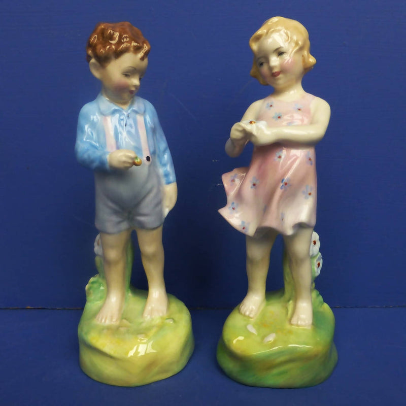 Royal Doulton Figurines He Loves Me HN2046 and She Loves Me Not HN2045