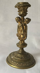 Victorian gilt brass neo classical candlestick adorned with putti harvesting grapes.