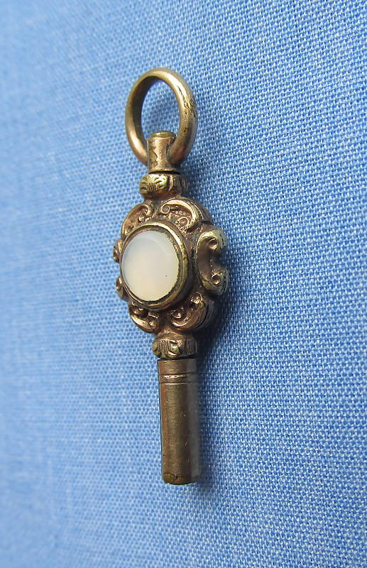 Gilded Metal Watch Key Mounted With Ruby & White "Stones"