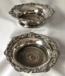 Victorian pair of silver plated bottle coasters with applied rims of trailing vines.