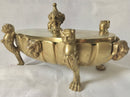 Regency period gilt bronze inkstand raised on lioness paw feet and adorned with ram masks.