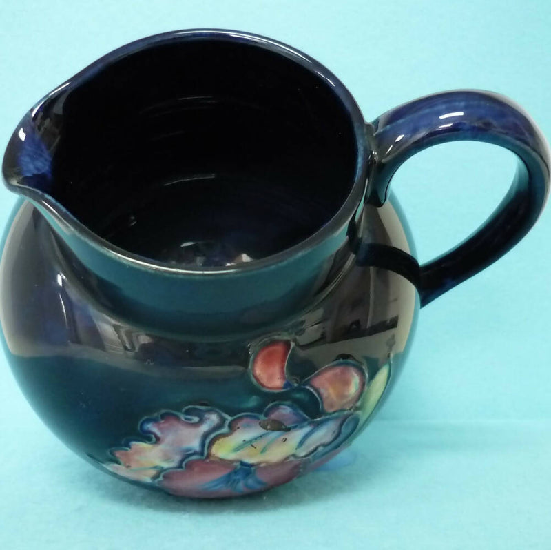 A Moorcroft (c1950's/60's) Jug in the Orchid Pattern by Walter Moorcroft