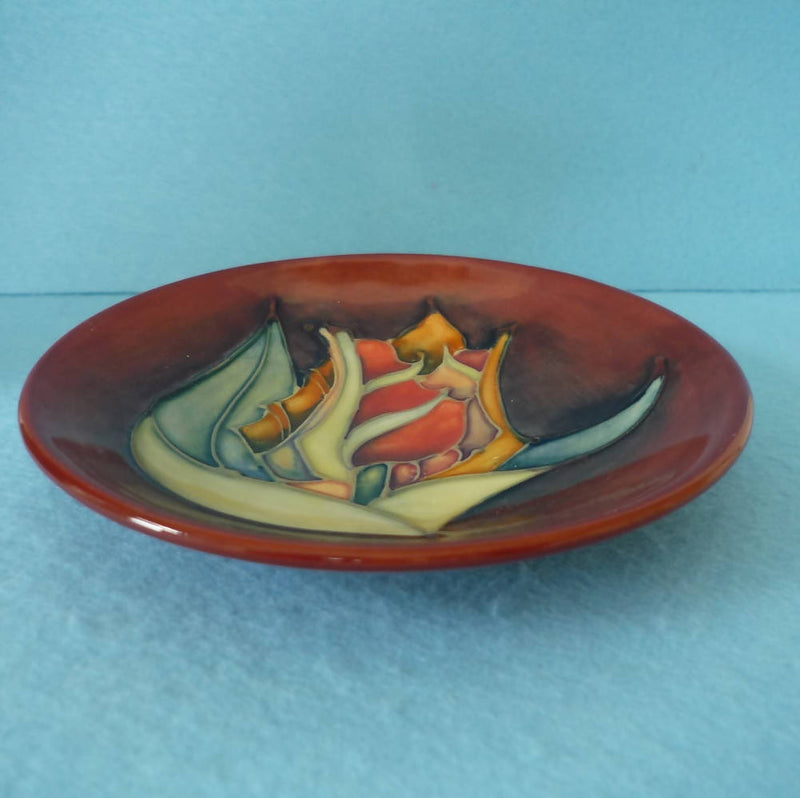 A Moorcroft Pin Dish in the Red Tulip Design by Sally Tuffin