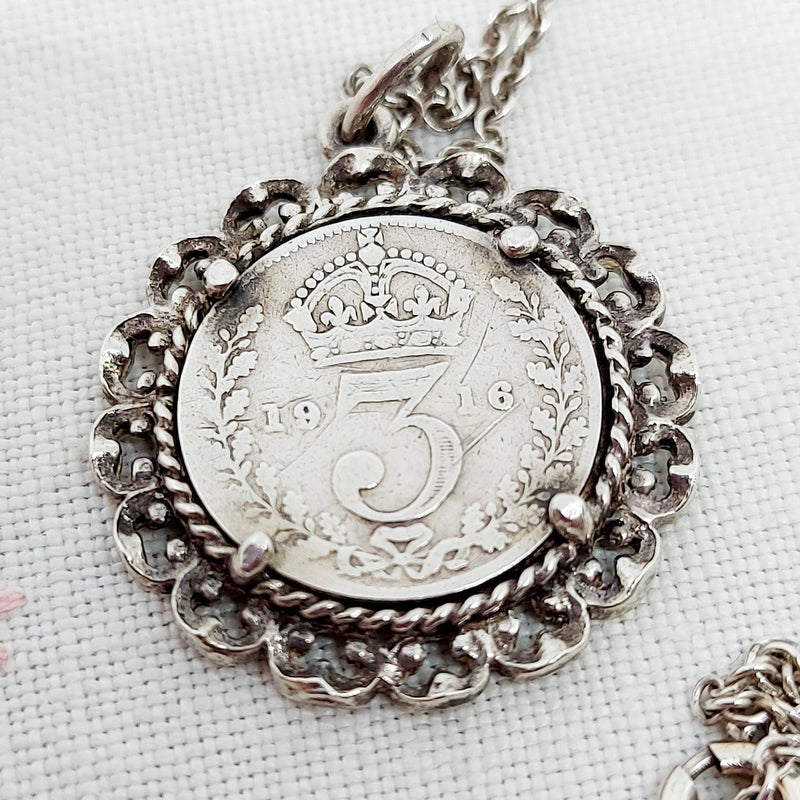 A 1916 Silver 3d Coin in a Silver Mount and Chain