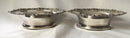 Victorian pair of silver plated bottle coasters with applied rims of trailing vines.