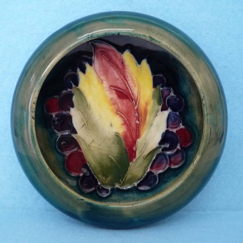 A Moorcroft Inverted Rim Bowl in Leaf and Berry by William Moorcroft