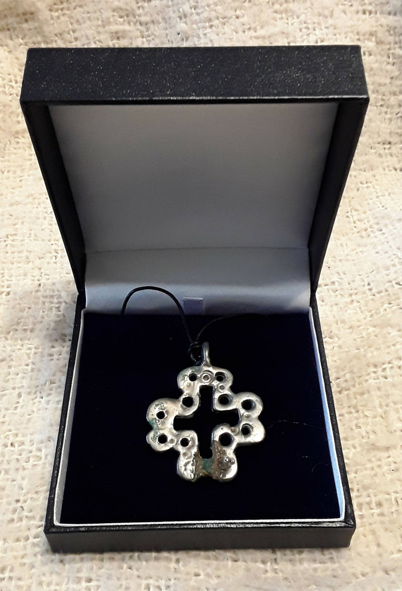 A Viking Period Silvered Bronze Openwork Neck Cross.