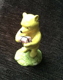 Royal Doulton Winnie The Pooh and the present figure Doulton Pooh the bear figurine