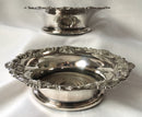 Victorian pair of silver plated bottle coasters with applied rims of trailing vines.