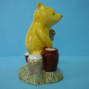 A Boxed Royal Doulton Winnie The Pooh Figurine - Pooh Counting The Honeypots