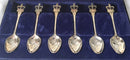 Cased set of Royal commemorative silver plated teaspoons with crown terminals.