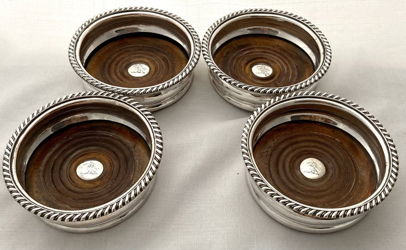 Georgian Set of Four Old Sheffield Plate Crested Wine Coasters, circa 1820.