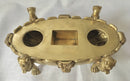 Regency period gilt bronze inkstand raised on lioness paw feet and adorned with ram masks.