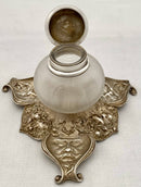 Victorian silver plated inkstand of trefoil form adorned with facial profiles. Elkington 1857 for The Art Manufacturers Association.