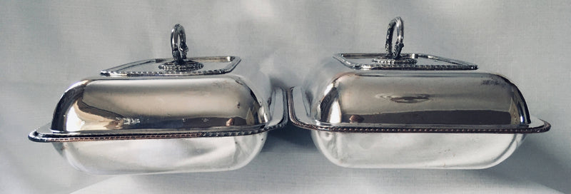Late Georgian pair of crested, Sheffield Plated, entree dishes and covers, circa 1820 - 1830.