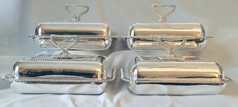 Georgian, George III, set of four Sheffield Plated entree dishes and covers with matching crests. Circa 1810.