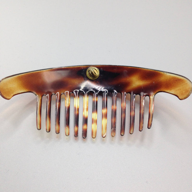 Large 1950's faux tortoiseshell hair comb with family crest