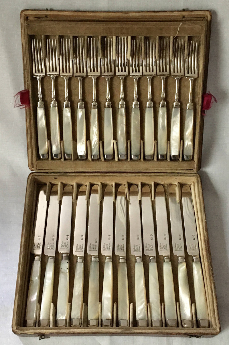 Georgian, George III, silver and mother of pearl dessert knives and forks for twelve, circa 1810.