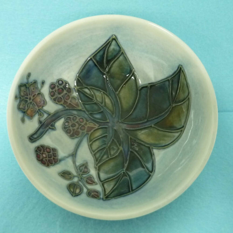 A Moorcroft Small Footed Bowl in the Bramble Pattern by Sally Tuffin
