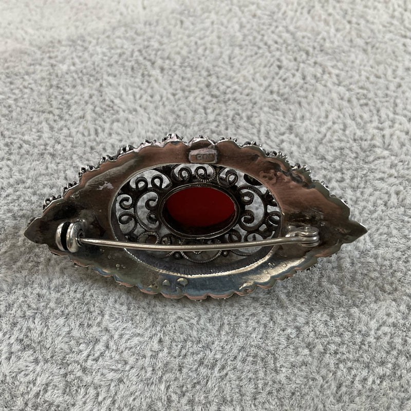 Silver and red coral brooch