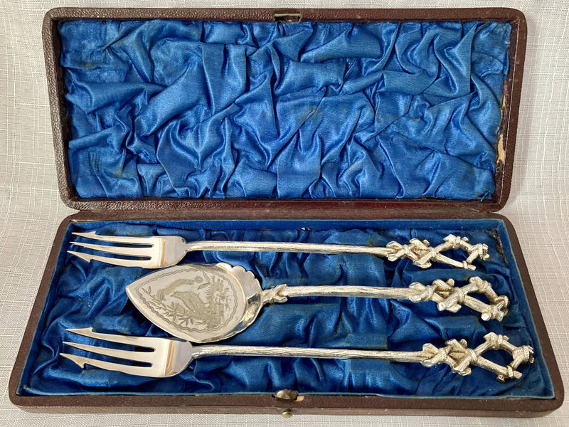 Cased set of Aesthetic movement naturalsitic pickle forks and preserve spoon, circa 1880 - 1900.