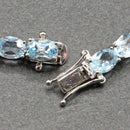 Silver blue topaz set line bracelet