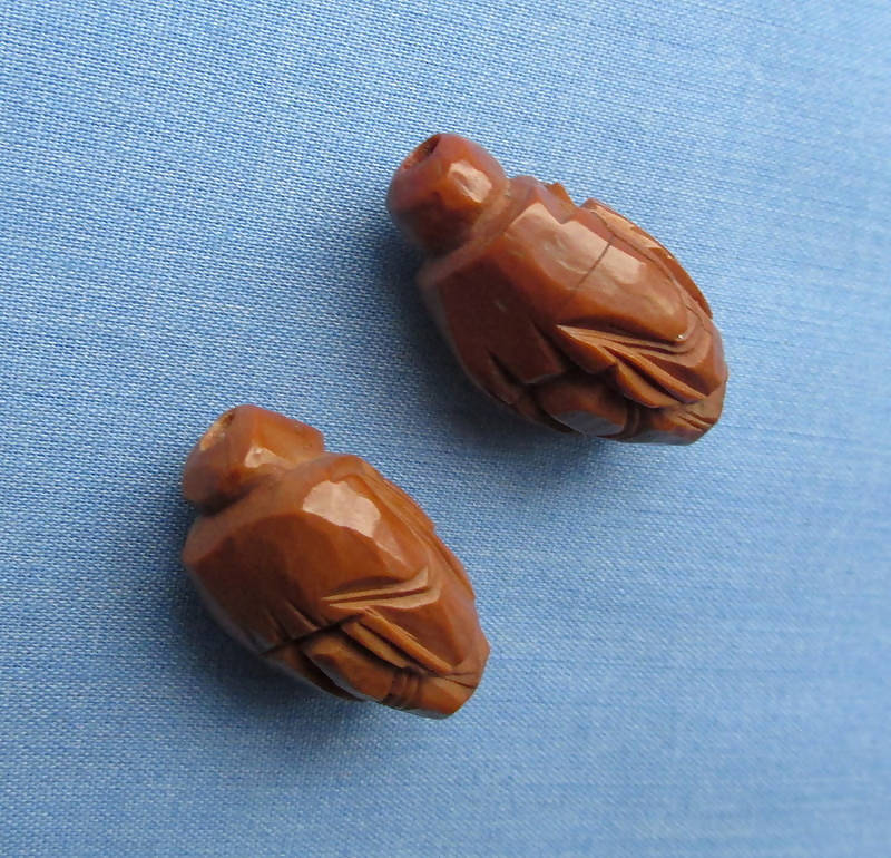 Two Figural Carved Nut Beads Plus Three Vegetable Ivory Beads